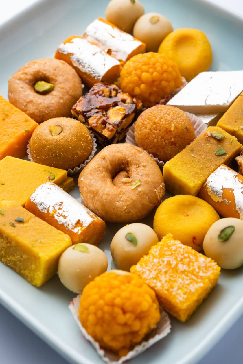 Assorted Indian sweets and mithai with diya at THE OMNII